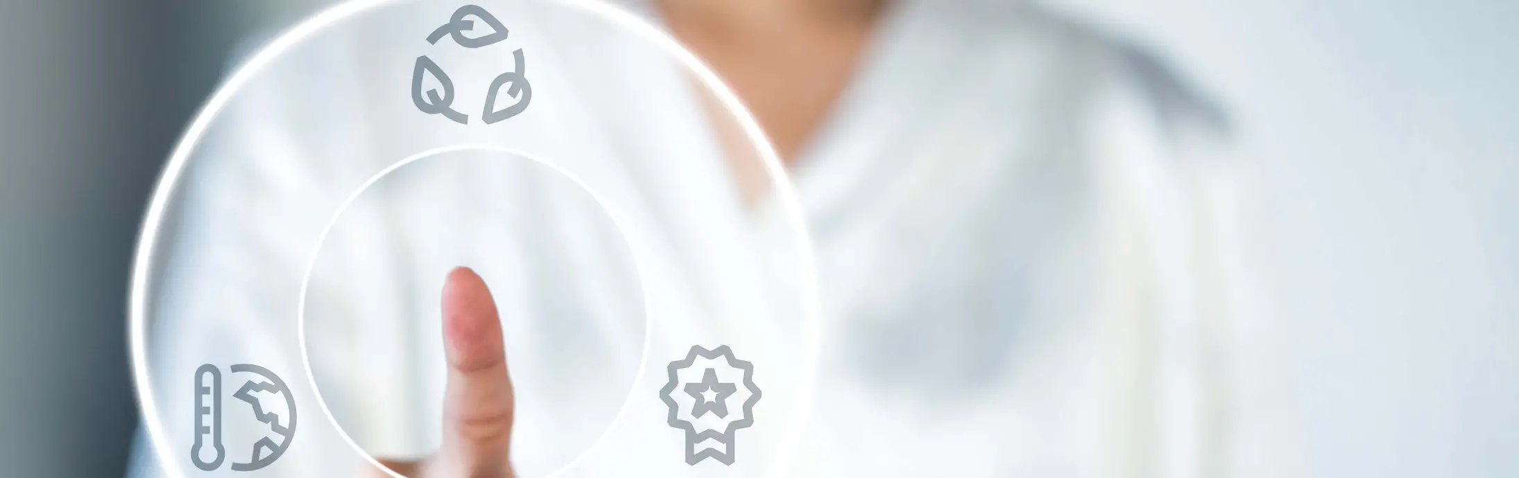 person pointing a finger on graphic displaying circularity, climate and transparency icons
