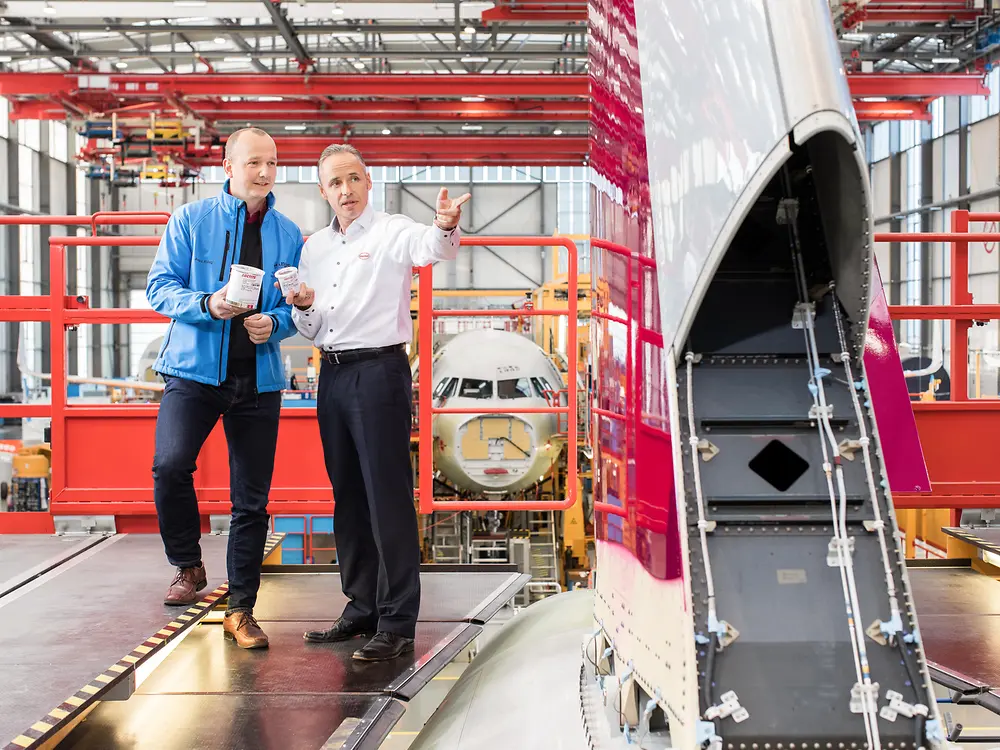 Henkel and Airbus employees in Airbus assemby hall.