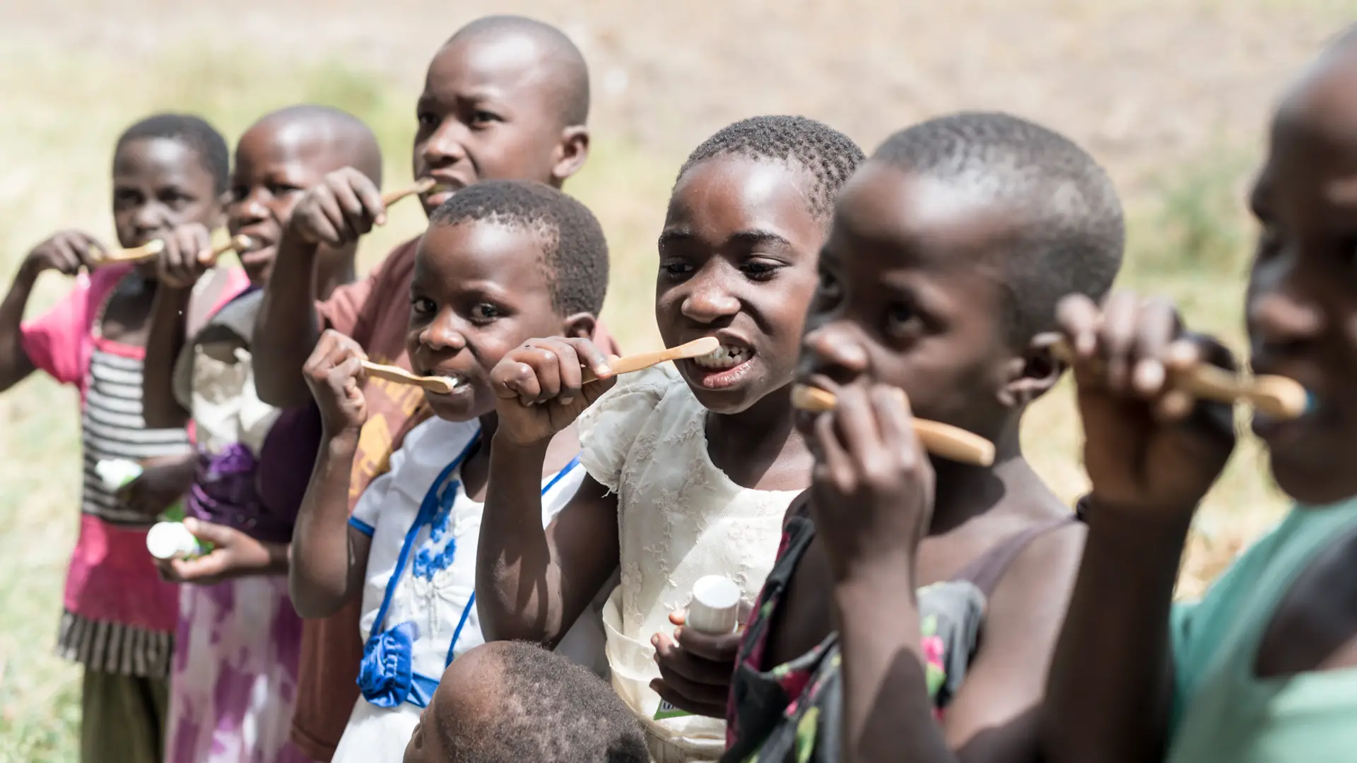 Children and their caregivers learn the right techniques for brushing their teeth